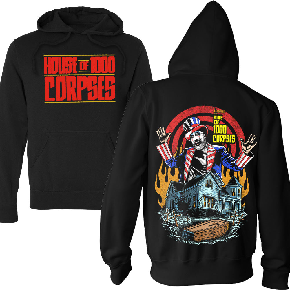 House Of 1000 Corpses Bless This House Pullover Hoodie in black featuring front logo print and back artwork with Captain Spaulding above the Firefly house, flames, graves, and a coffin.