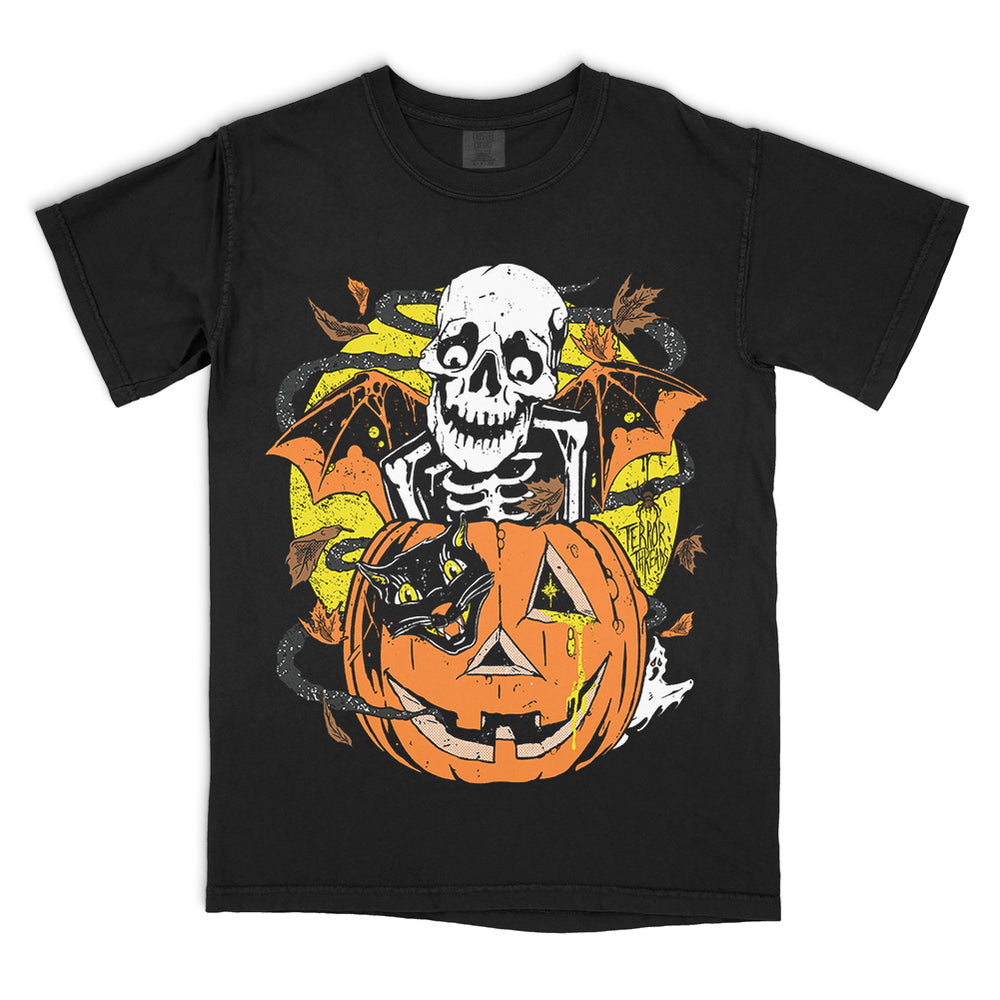 Terror Threads Bones O Lantern T-Shirt on a black Comfort Colors Tee featuring a skeleton, jack-o’-lantern, black cat, bats and ghosts in a vintage Halloween design