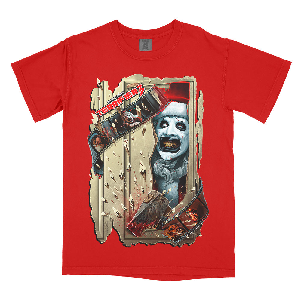 Red Comfort Colors Terrifier 3 Chop House tee featuring Art the Clown bursting through a shattered doorway with a bloodied axe and filmstrip details.