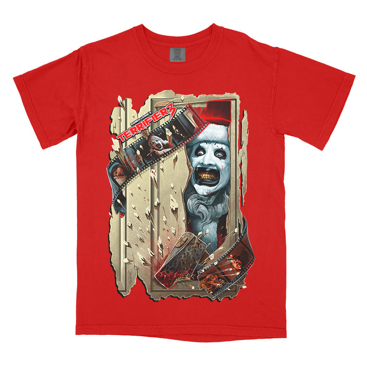 Red Comfort Colors Terrifier 3 Chop House tee featuring Art the Clown bursting through a shattered doorway with a bloodied axe and filmstrip details.