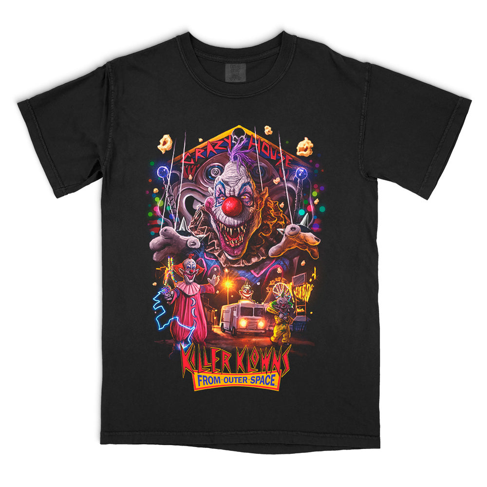 Officially licensed Killer Klowns From Outer Space Crazy House T-Shirt design featuring giant evil Klown artwork with neon carnival scene on black Comfort Colors tee