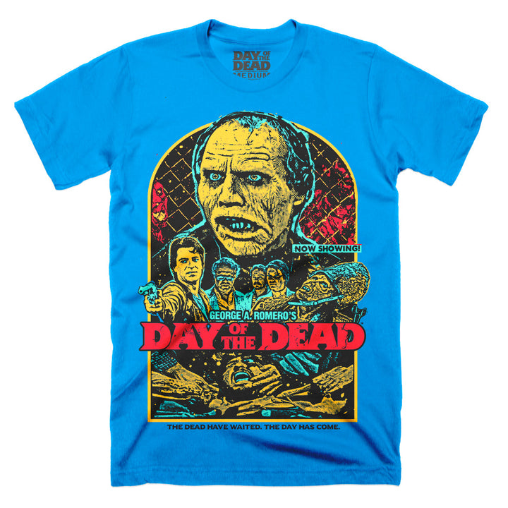 Day of the Dead The Dead Have Waited T-Shirt on a sapphire Classic Terror Threads Tee featuring Bub and characters from George A. Romero’s zombie classic in a colorful retro poster design