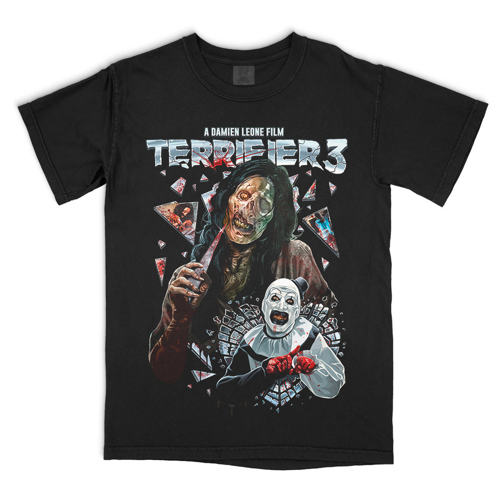 Terrifier 3 Glass Act T-Shirt on a black Comfort Colors Tee featuring Victoria Heyes holding a shard of glass above Art the Clown surrounded by shattered mirror pieces