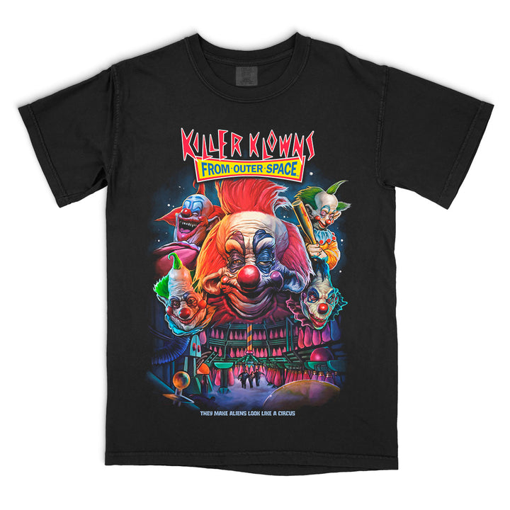 Officially licensed Killer Klowns From Outer Space Join The Circus Comfort Colors t-shirt featuring vibrant artwork of the Killer Klowns, their creepy alien circus, and the classic horror movie logo.