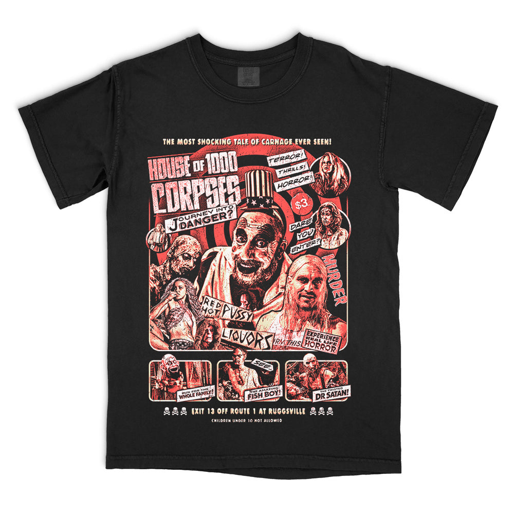 House Of 1000 Corpses Journey Into Danger T-Shirt on black Comfort Colors tee featuring Captain Spaulding, Baby, Otis, Dr. Satan, Fish Boy, and Murder Ride roadside attraction artwork.
