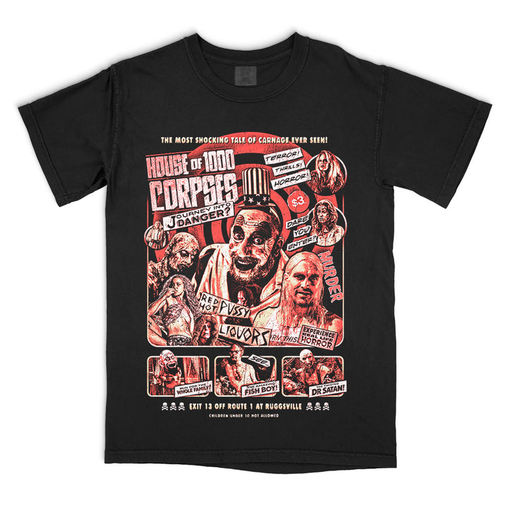 House Of 1000 Corpses Journey Into Danger T-Shirt on black Comfort Colors tee featuring Captain Spaulding, Baby, Otis, Dr. Satan, Fish Boy, and Murder Ride roadside attraction artwork.
