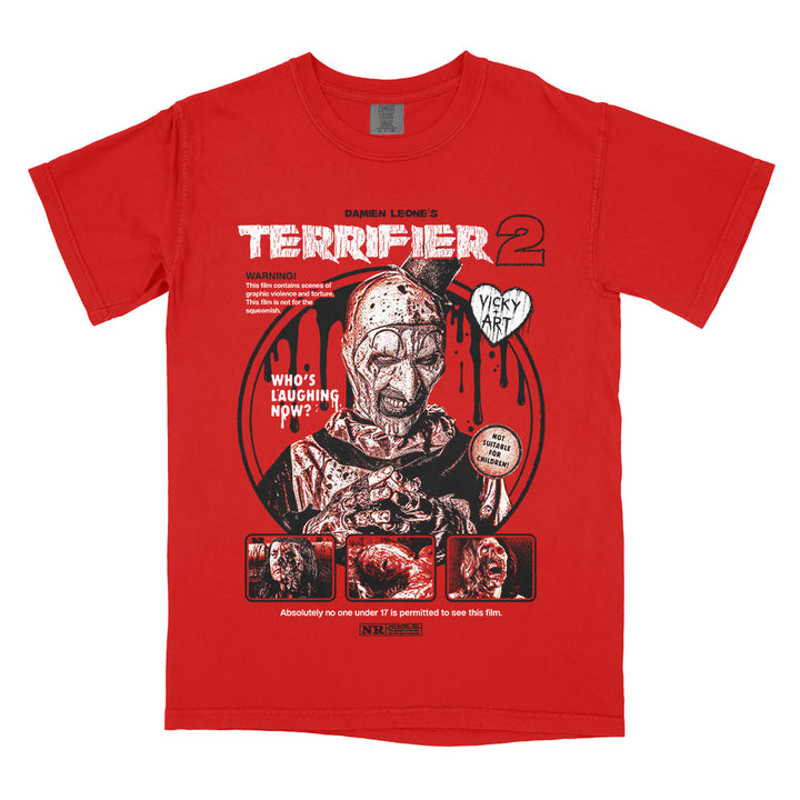 Terrifier 2 Last Laugh T-Shirt featuring blood-soaked Art the Clown with retro horror warning graphics on red Comfort Colors tee