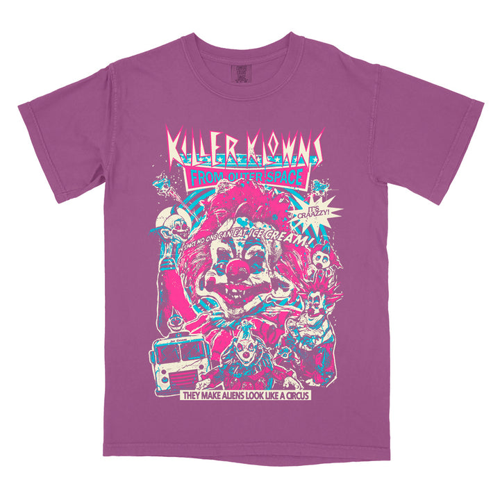 Officially licensed Killer Klowns From Outer Space Like A Circus Comfort Colors purple t-shirt featuring colorful retro-style artwork of the Killer Klowns, their sinister circus, and the classic movie tagline.