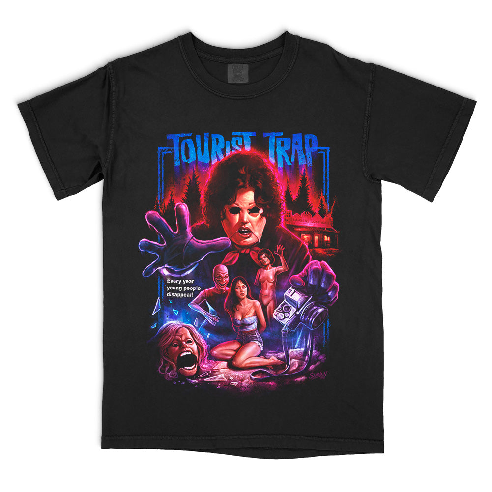 Tourist Trap Lost Oasis officially licensed Comfort Colors tee featuring Slausen, Eileen, Becky and the roadside museum in vivid red and blue horror artwork.