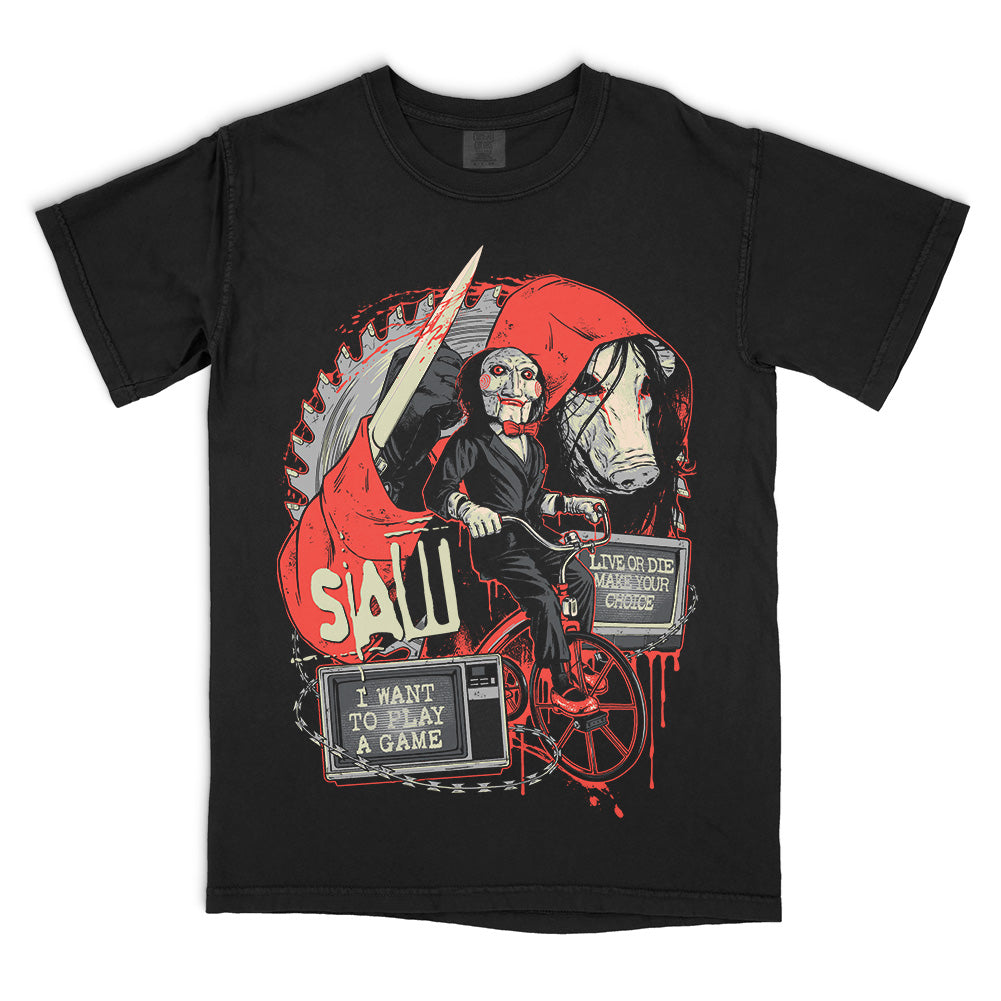 Black Comfort Colors SAW Make Your Choice T-Shirt featuring Billy the Puppet on his tricycle, the pig mask, circular saw blade, knife and blood-red film imagery.