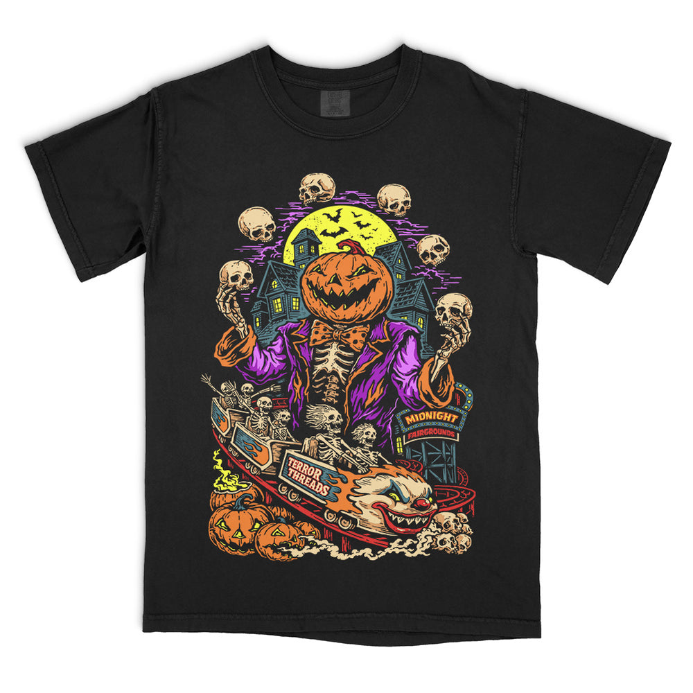 Terror Threads Midnight Fairgrounds original graphic on a black Comfort Colors T-Shirt featuring a pumpkin-headed skeleton ringmaster, haunted carnival rides, jack-o’-lanterns, skulls and a spooky full moon.