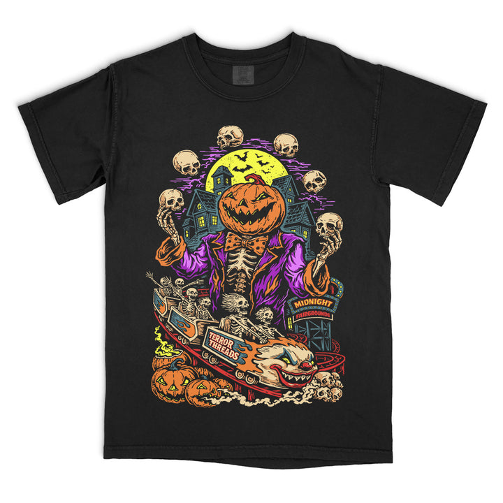 Terror Threads Midnight Fairgrounds original graphic on a black Comfort Colors T-Shirt featuring a pumpkin-headed skeleton ringmaster, haunted carnival rides, jack-o’-lanterns, skulls and a spooky full moon.