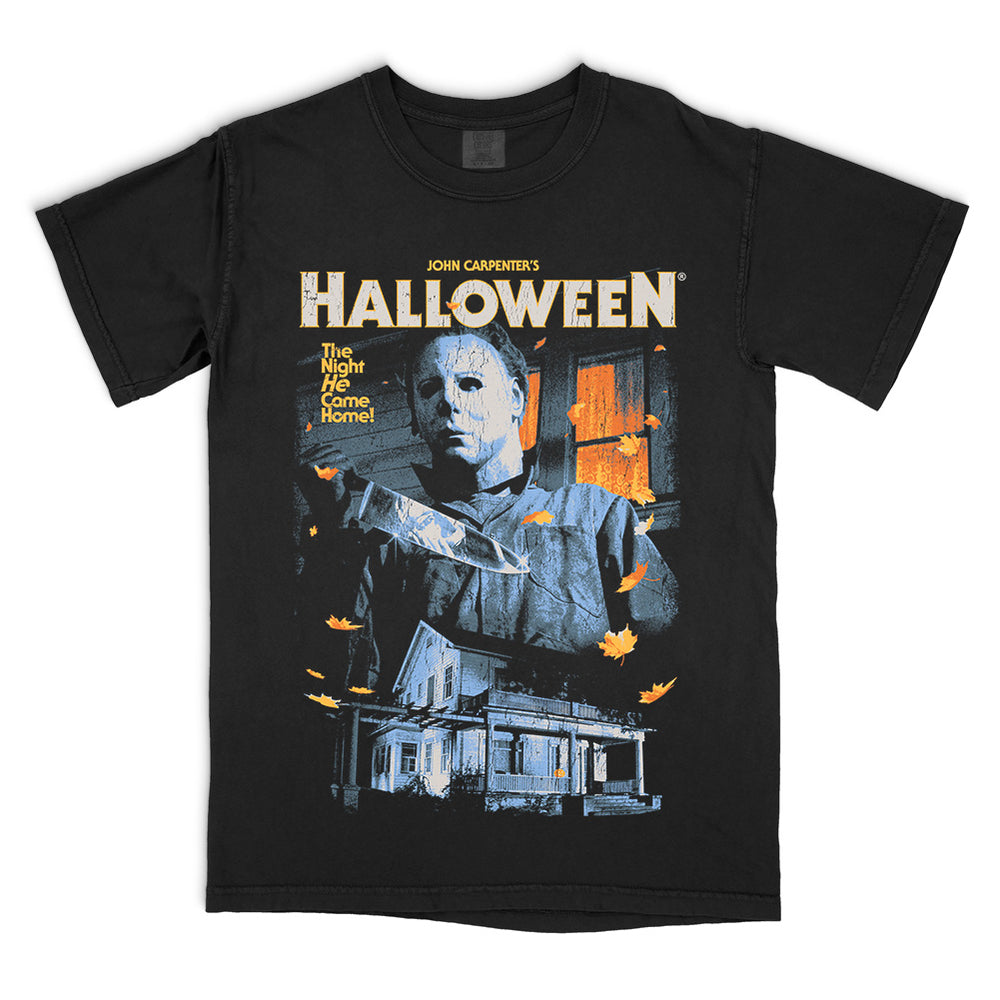 Halloween No Place Like Home T-Shirt featuring Michael Myers, the Myers house, classic Halloween movie logo and orange autumn leaves on a black Comfort Colors tee