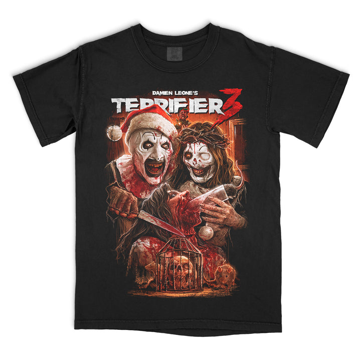 Terrifier 3 Saint Sicko T-Shirt on a black Comfort Colors Tee featuring Art the Clown in a Santa suit, Victoria Heyes and a blood-soaked holiday horror scene