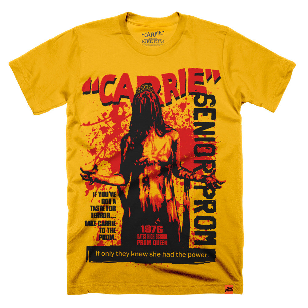 Officially licensed Carrie “Senior Prom” T-shirt featuring blood-soaked Carrie White in vintage poster-style artwork with bold red and black design on gold tee.