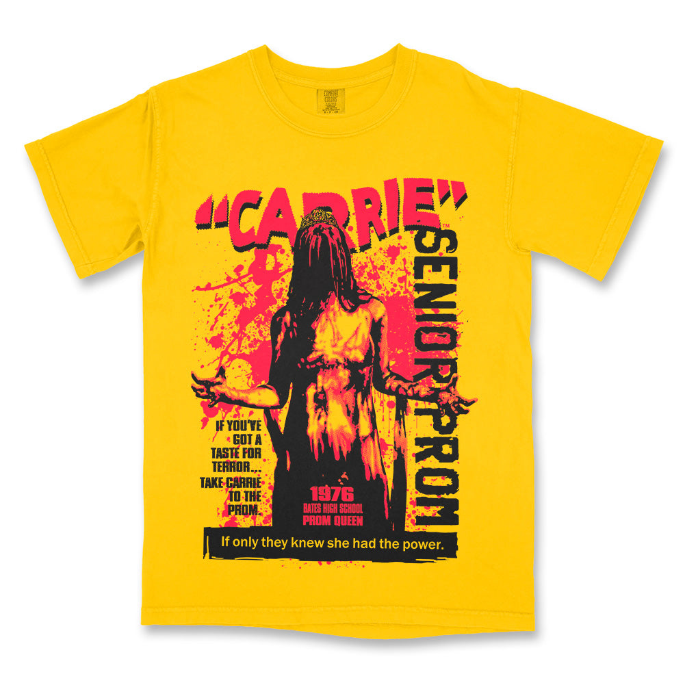 Carrie Senior Prom T-Shirt on a yellow Comfort Colors Tee featuring a blood-covered Carrie crowned prom queen in a bold red and black retro horror design