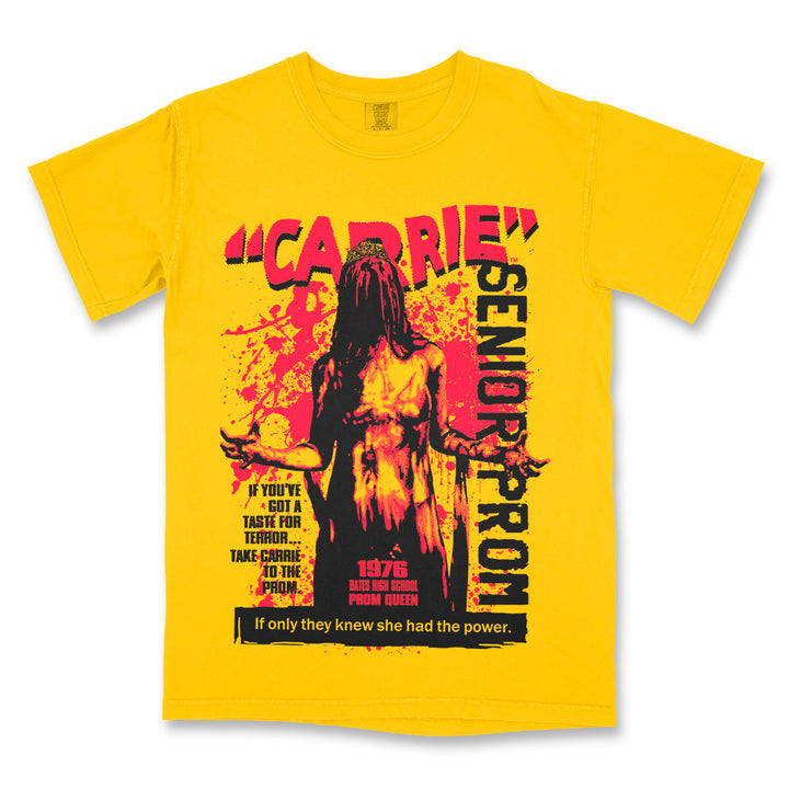 Carrie Senior Prom T-Shirt on a yellow Comfort Colors Tee featuring a blood-covered Carrie crowned prom queen in a bold red and black retro horror design