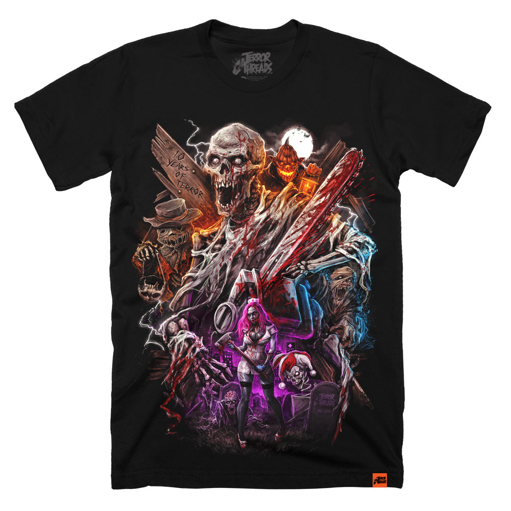 Black t-shirt featuring a large, colorful horror collage design with a screaming skeletal figure holding a blood-covered chainsaw at the center, surrounded by a scarecrow, jack-o’-lantern, masked characters, lightning effects, and a pink-haired female character, with “10 Years of Terror” carved into wood in the background.