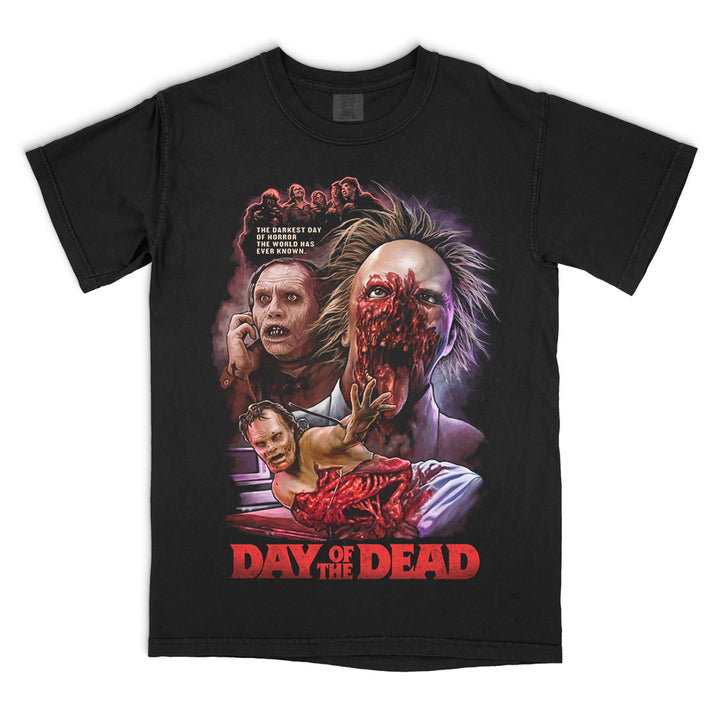 Day Of The Dead "They Are Us" T-Shirt on a black Comfort Colors tee featuring full-color artwork of zombies and iconic scenes from George A. Romero's classic horror film.